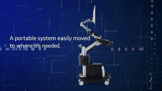 파란색 배경에 'A portable system easily moved to where it's needed.'라는 문구와 함께 바퀴 달린 이동형 초음파 장비가 보인다 — 초음파 정밀 진단 | 서울 바로한의원 초음파 약침·도침·침도